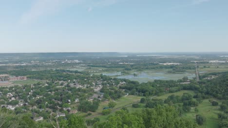 tilt up drone shot of grandad bluff overlooking the city of la crosse, the mississippi river valley, wisconsin in usa. famous symbol of the great driftless region.