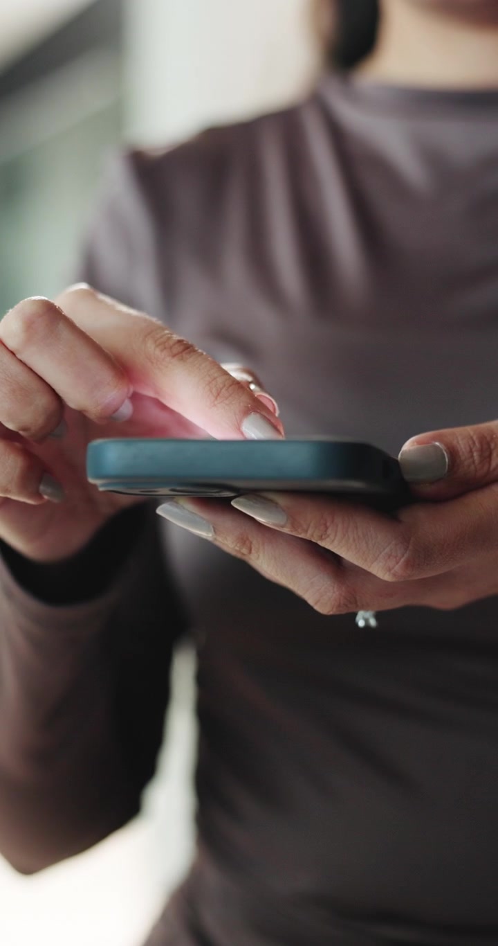 Woman Using Smartphone for Browsing and Communication