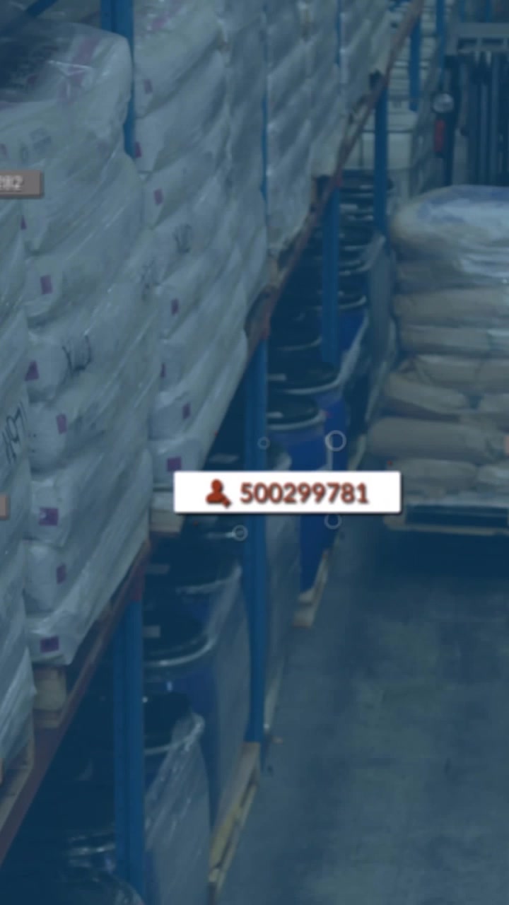 Vertical video: Cursor hovering near drum tag, system updating ID overlays for warehouse inventory