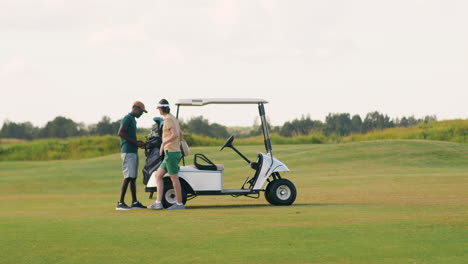 caucasian woman and african american man on the golf course.