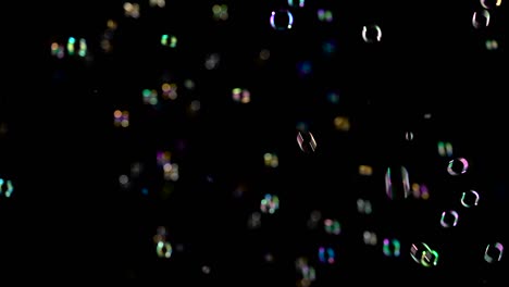 different size and color soap bubbles fly black backgrounds different size and color soap bubbles fly in the air black backgrounds