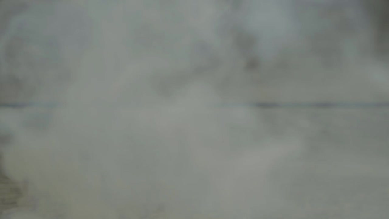 Smoke against a wooden indoors background