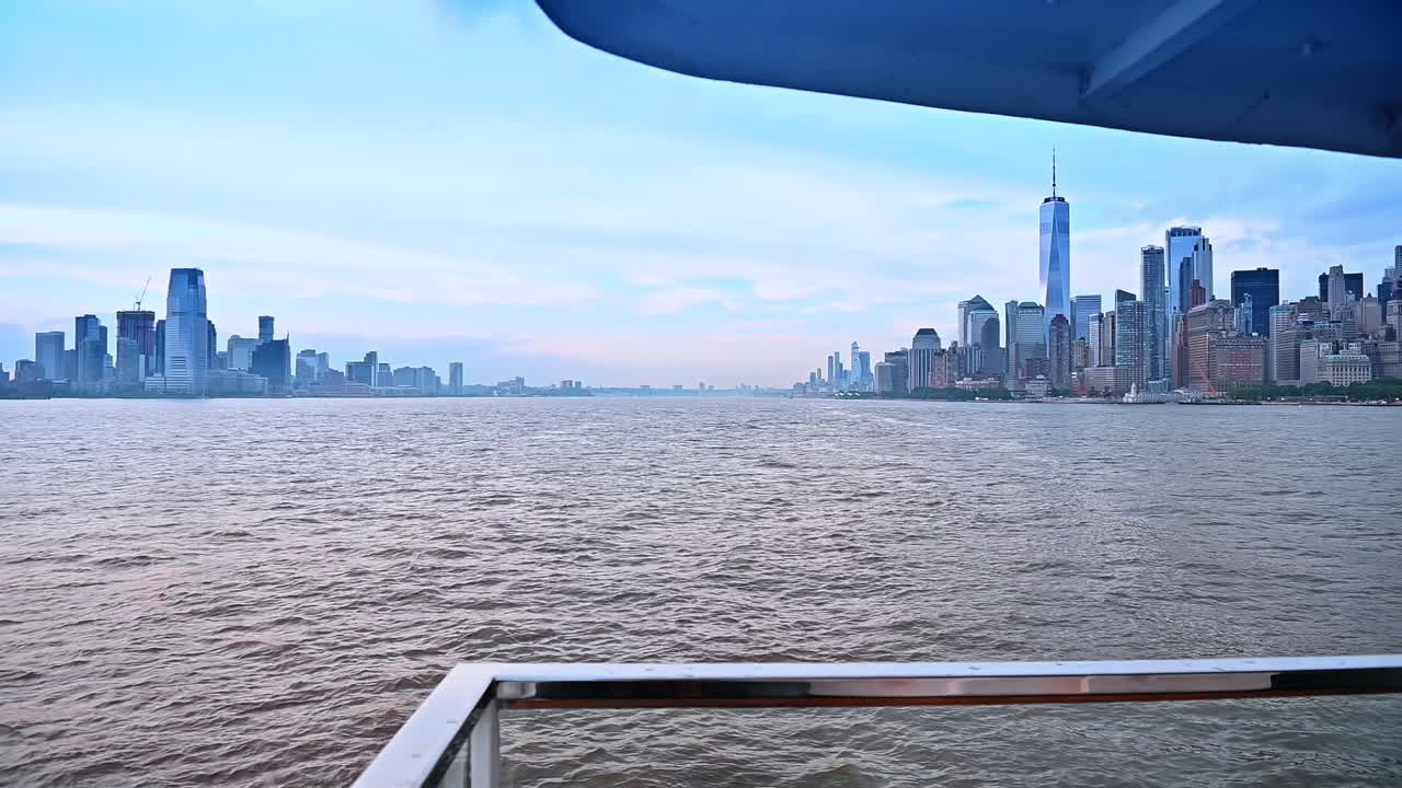 Standing on the deck of the riverboat travelling by the East River. View on the architecture of Manhattan in New York, USA