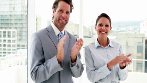 Business-people-applauding-the-camera