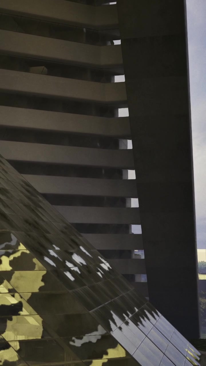 Estrutura de edifício reflete na superfície à luz do entardecer.