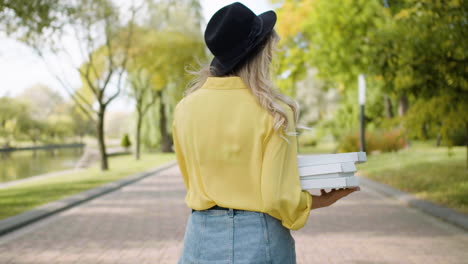 smiling woman walking at park