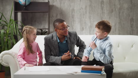 girl raises hand confused boy thinks at english lesson