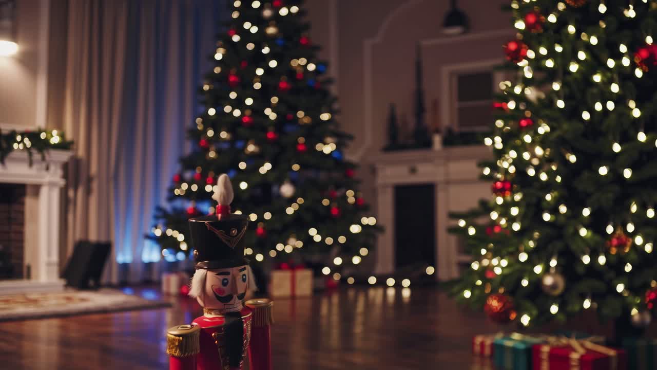 Festive holiday scene with a nutcracker in focus, surrounded by lit Christmas trees