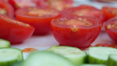 closeup of sliced tomatoes and cucumbers