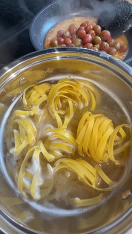 cooking pasta with cherry tomatoes