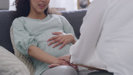 pregnant woman consulting doctor at home