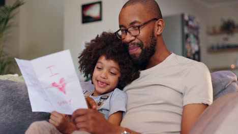 father and child looking at drawing