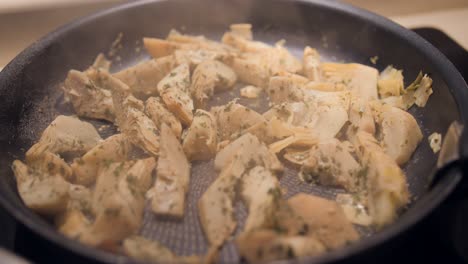 Stir-Fry-Artichoke-Cooking-In-The-Frying-Pan,-Typical-Meal-In-Spain