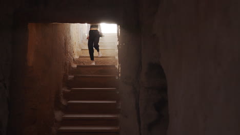 woman exploring ancient ruins