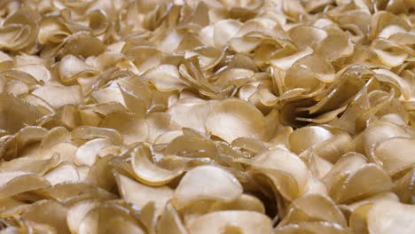 slow motion shot of raw krupuk snacks ready for frying, indonesia