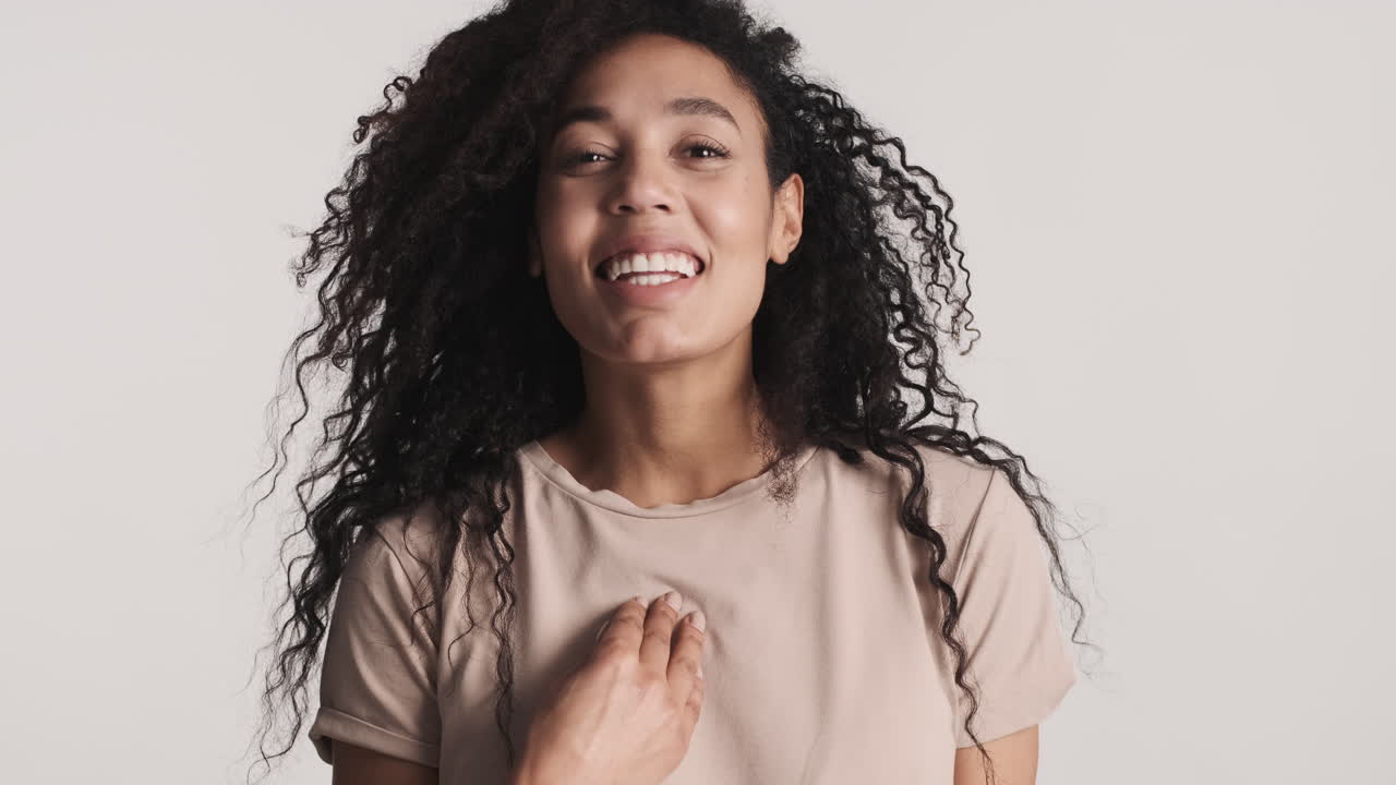 African american cheerful woman over white background.