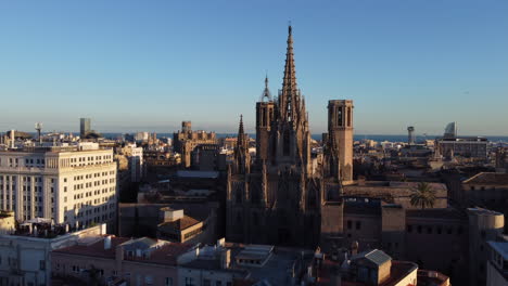 coastal skyline of barcelona at sunset. aerial reveal