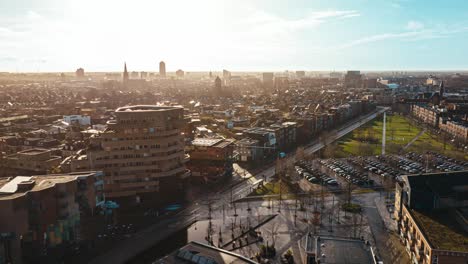 Aerial-hyperlapse-showing-buildings,-cars-and-city-landscape