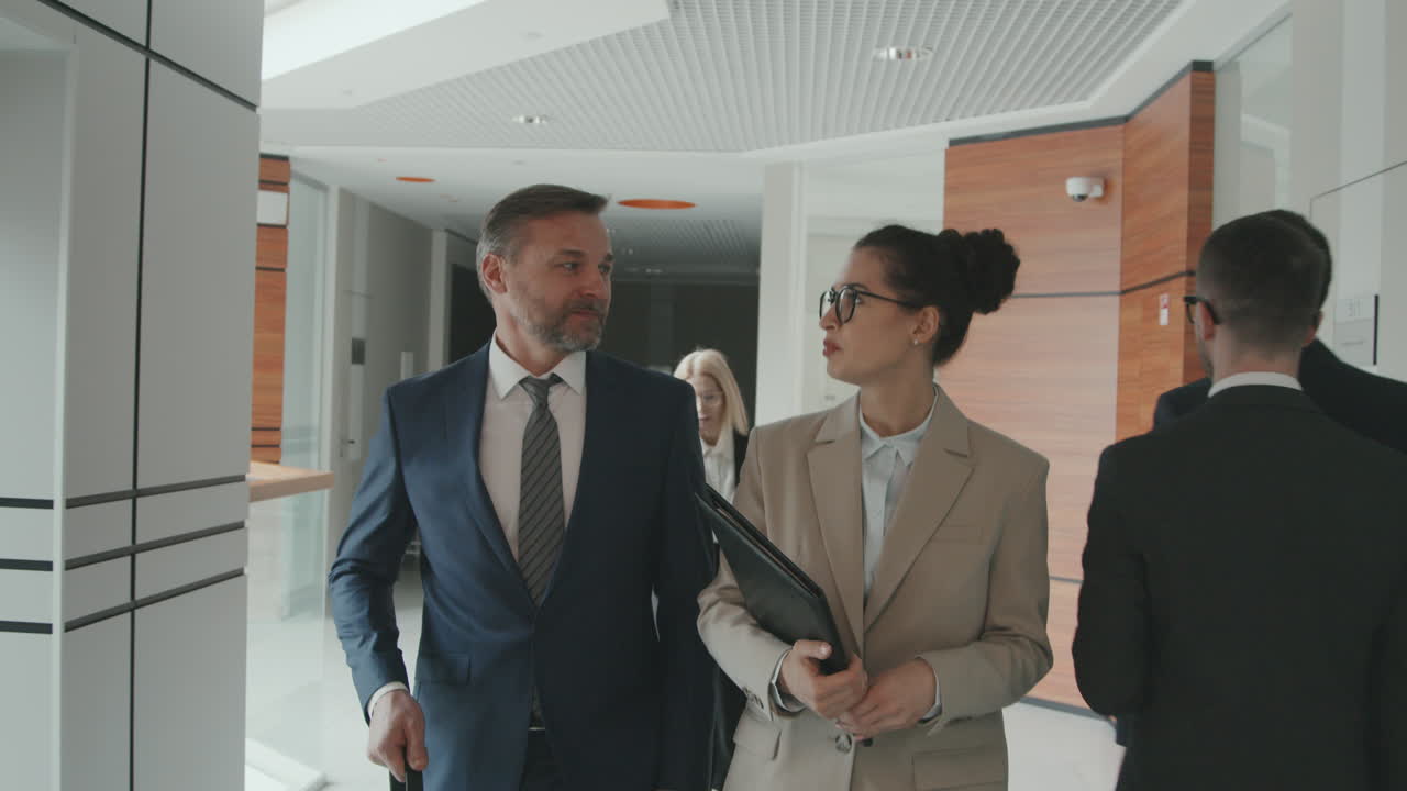 Business Couple Walking through Office