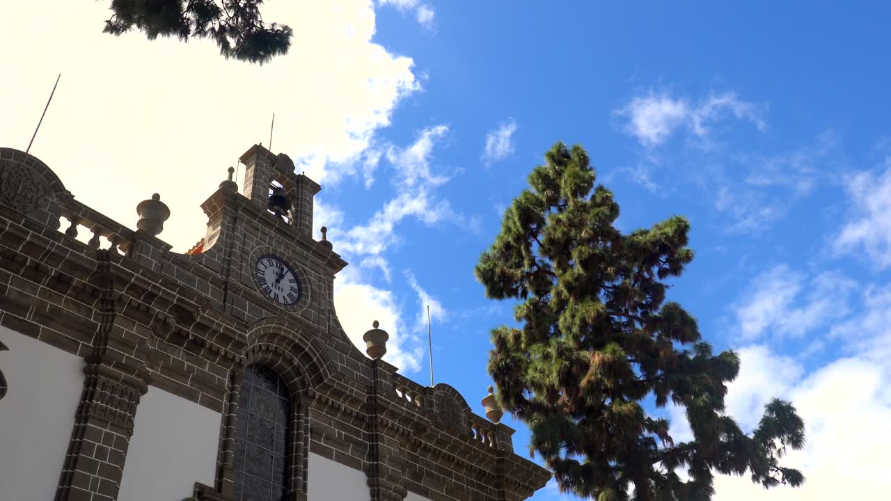 Building with Clock Tower and Tree Under Blue Sky