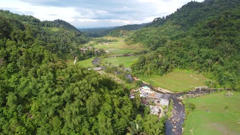 drone shot, rural area between tropical forests