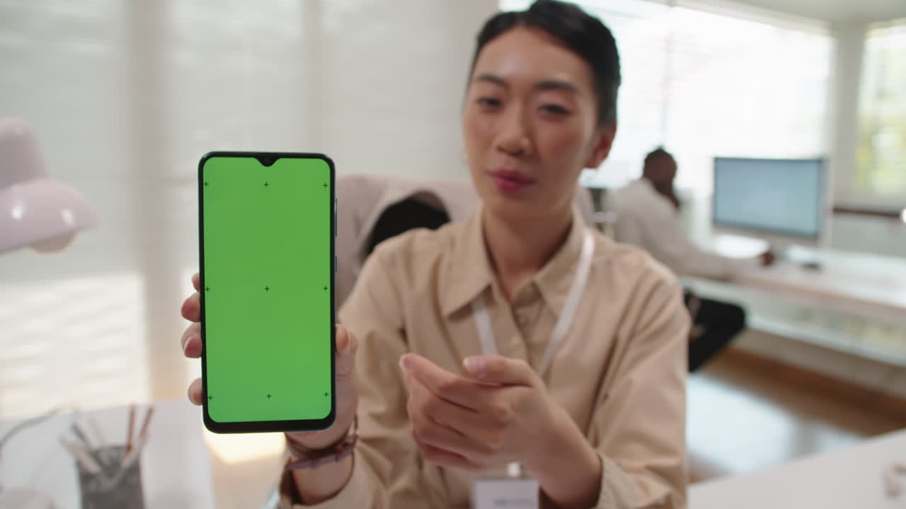 Woman Giving Presentation on Application for Smartphones