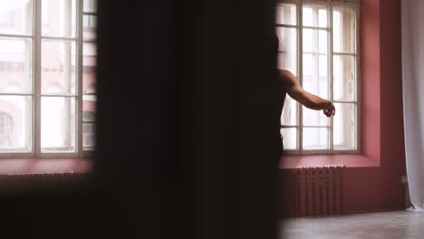 Young-man-dancing-in-a-classroom