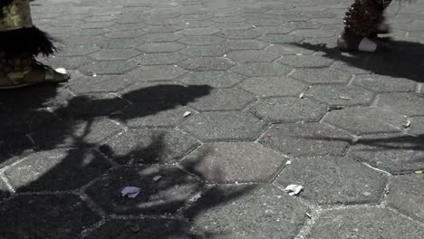 Feet-of-Mexican-people-in-Mayan-costume-dancing-in-the-streets