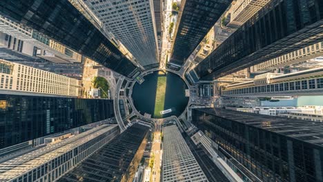 aerial top-down view of skyscrapers and river in a modern city