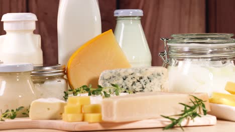 various dairy items displayed on a wooden surface