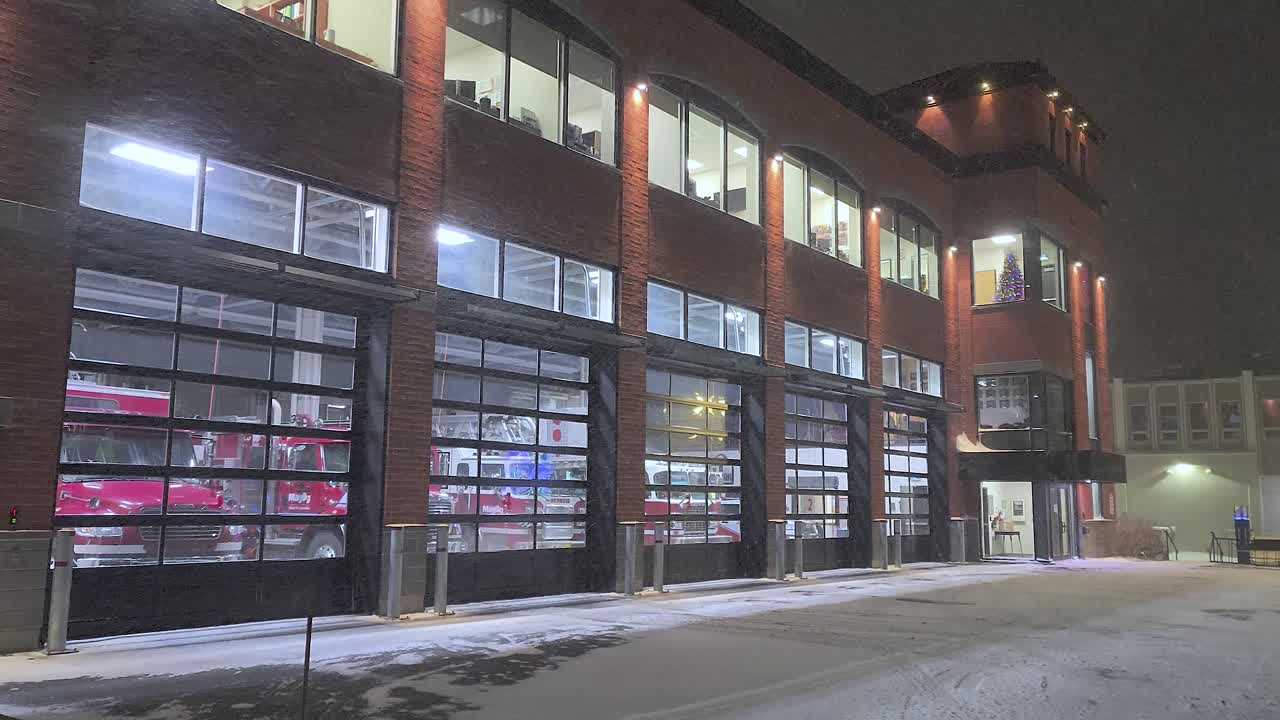 Fire station during snowfall at night in Orford, Quebec, Canada