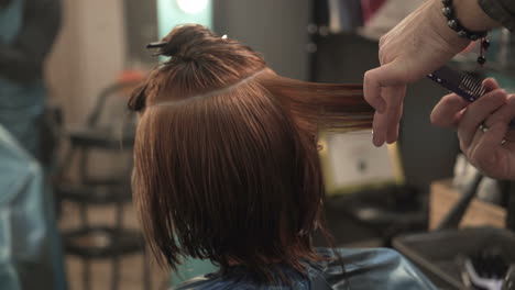 young woman and hairdresser making styling hair at beaty salon