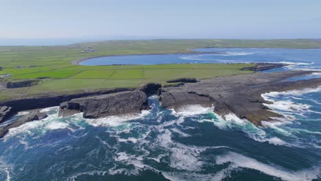 Aerial-spin-view-around-coastline-near-Bridge-of-Ross-rock-formation