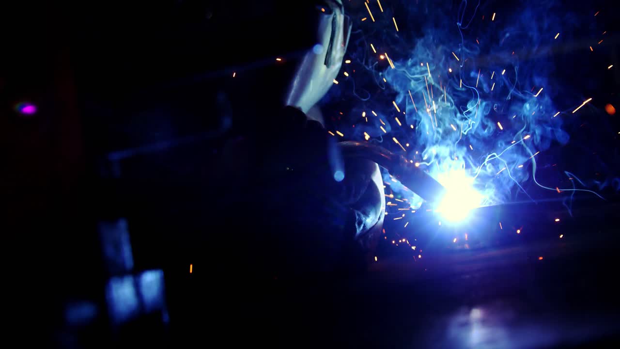 Welder working on a piece of metal