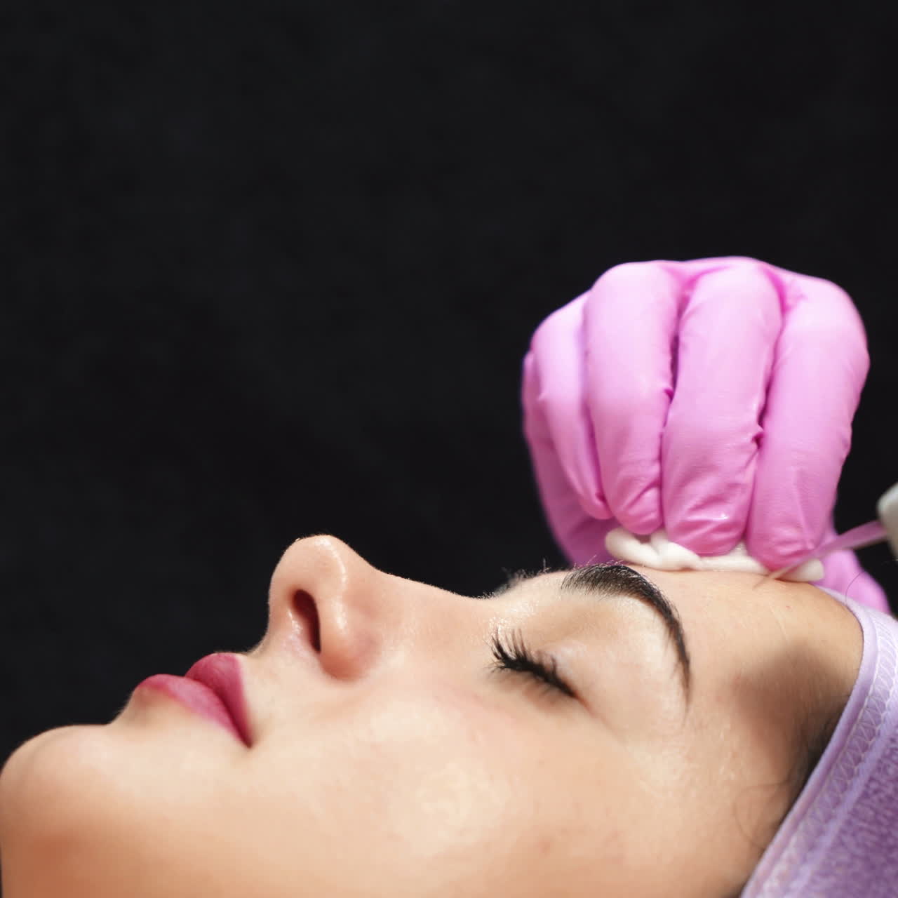 Beautiful woman in a beauty salon. Professional procedure of ultrasonic face cleansing. Cosmetologist job. Aesthetic cosmetology.