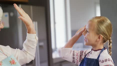 Grandmother-and-granddaughter-giving-high-five-4k