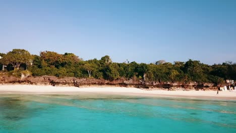 calmer aerial flight slider fly sideways from right to left drone shot dream nature beach coast line turquoise water zanzibar, africa tanzania 2019 cinematic aerial filmed 1080, 60p at philipp marnitz