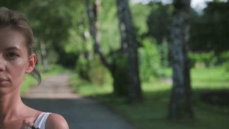 portrait of beautiful blonde girl running outdoors in a sunny day