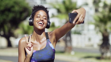 a-sporty-young-woman-taking-a-selfie