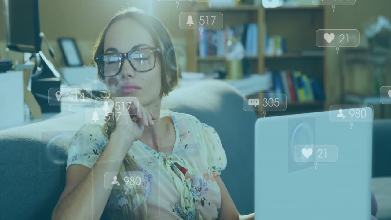 Using laptop, woman surrounded by animation of social media notifications