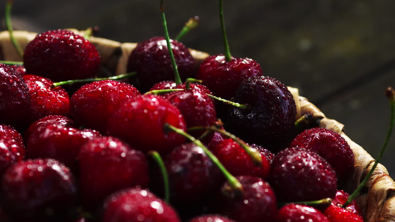 Fresh cherry with water drops on dark background. Fresh cherries background. Healthy food concept.