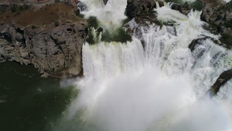 A-4K-drone-shot-of-Shoshone-Falls,-a-raging-waterfall,-which-often-reflects-rainbows,-located-along-the-Snake-River,-only-3-miles-away-from-Perrine-Bridge-and-Twin-Falls,-Idaho