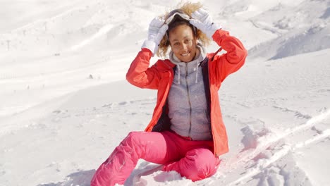 Young-woman-relaxing-in-thick-winter-snow