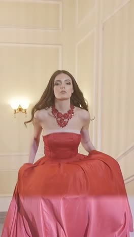 elegant woman in red ball gown