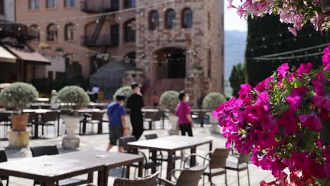 people enjoying a sunny day at an outdoor cafe