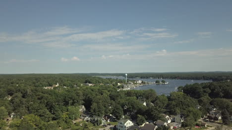 Rising aerial shot overlooking Pentwater lake in downtown Pentwater Michigan