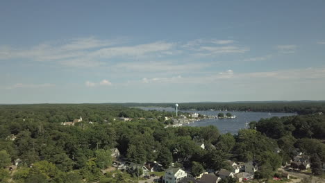 rising aerial shot overlooking pentwater lake in downtown pentwater michigan