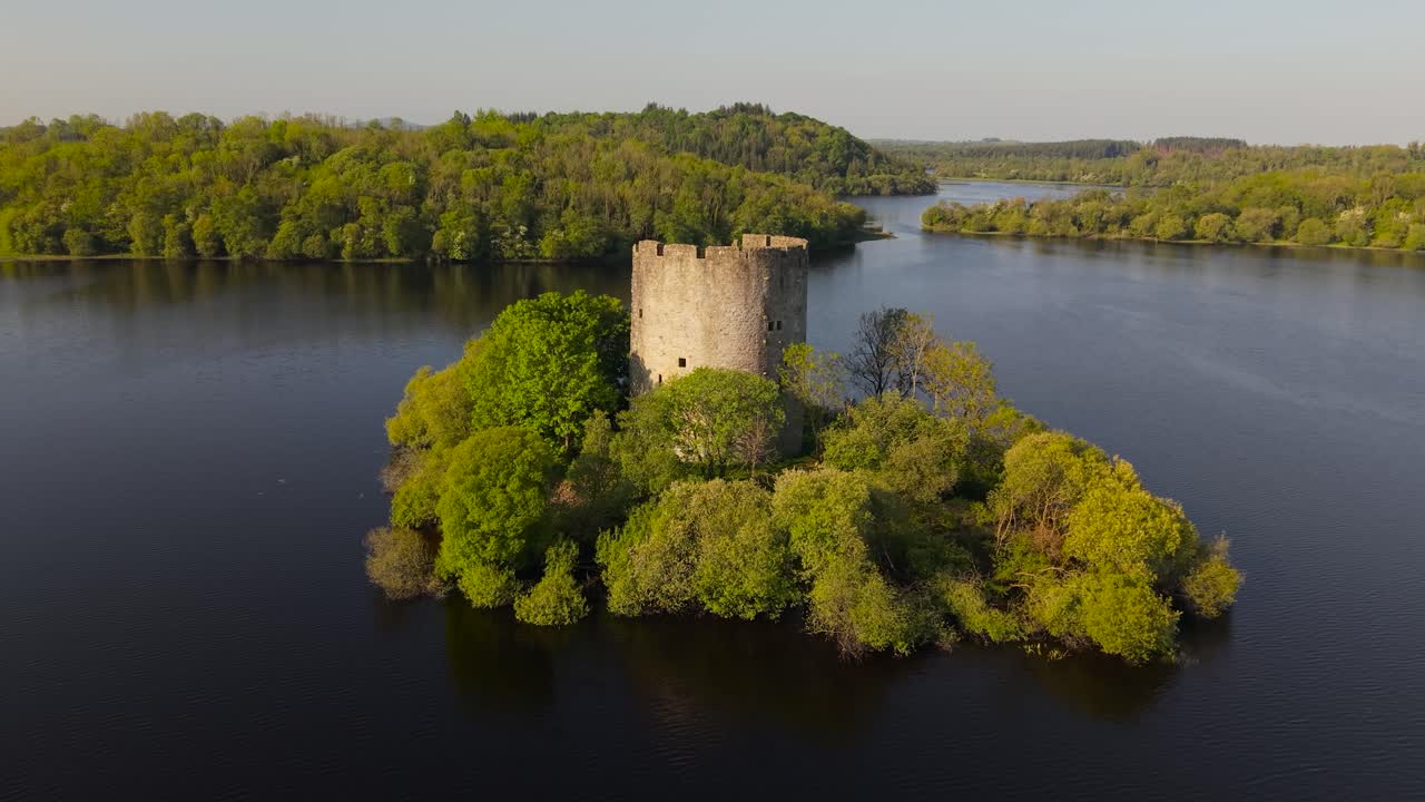 Cloughoughter Castle stands as a majestic ruin on a small island in the calm waters of Lough Oughter, County Cavan, Ireland, surrounded by lush greenery