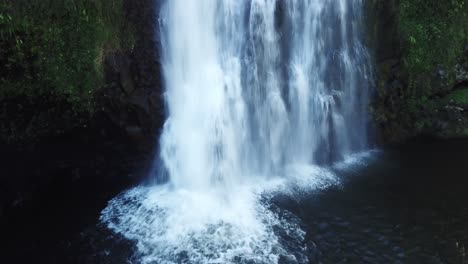 close-up of a powerful waterfall cascading into a pool