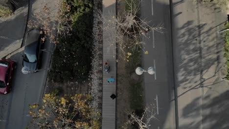 railroad park with joggers and bicycle trails, aerial view